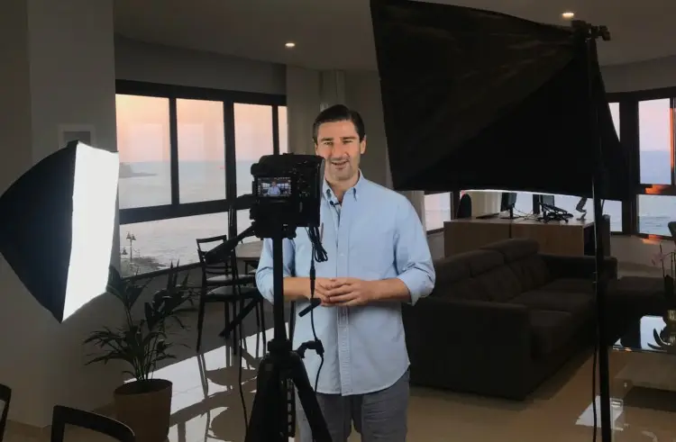 Liam Austin setting up to record a high-quality podcast remotely from his home studio in Malta.