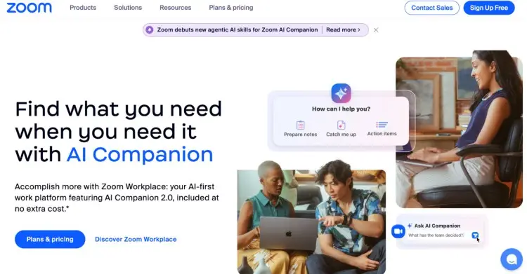Zoom homepage promoting its AI Companion with multiple people working on laptops and communicating online.