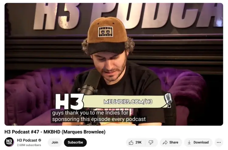 Podcast host on H3 Podcast reading a sponsor message for MeUndies as part of a podcast advertising campaign, with branding and call-to-action link on screen.