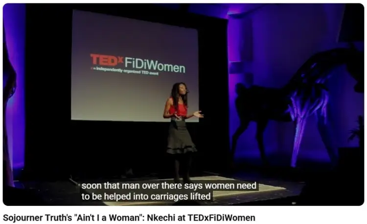 Speaker presenting on stage at a TEDx event demonstrating a logical argument to support ideas and persuade an audience
