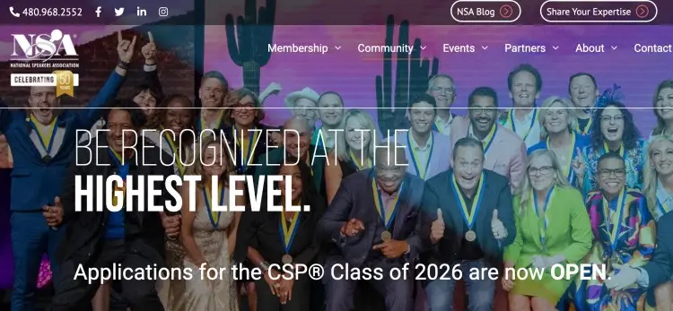Professional public speaker recognition event showing group of speakers celebrating achievement at a high level certification program