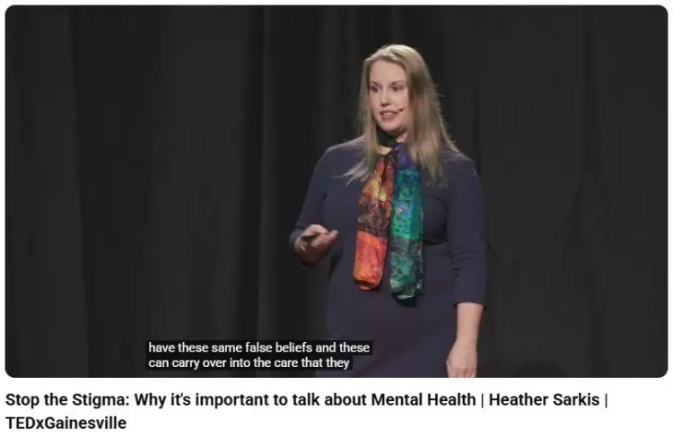 TEDx speaker delivering a powerful and persuasive talk about mental health awareness and breaking social stigma.
