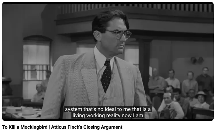 Atticus Finch delivering a courtroom argument designed to convince an audience through credibility and character