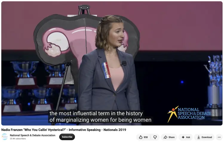Student speaker educating an audience about a specific topic during an informative speech competition