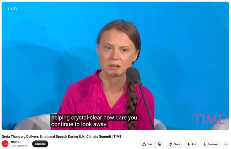 Speaker at a climate summit demonstrating how an informative speech aims to explain an important issue to an audience