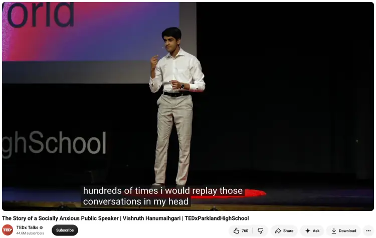 TEDx speaker discussing living with social anxiety while giving a talk on stage