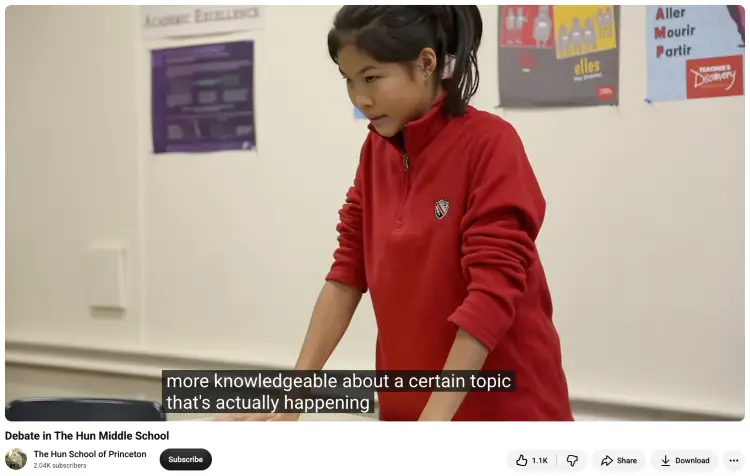 Middle school student preparing for a debate by researching and discussing a current topic