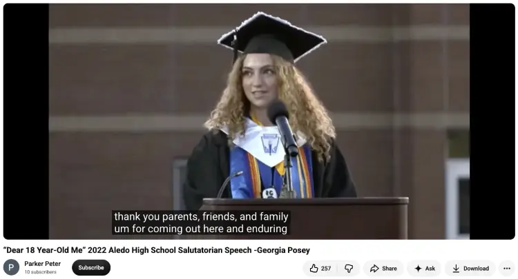 Female graduate in a black cap and gown giving a salutatorian speech to express gratitude to parents, friends, and family.