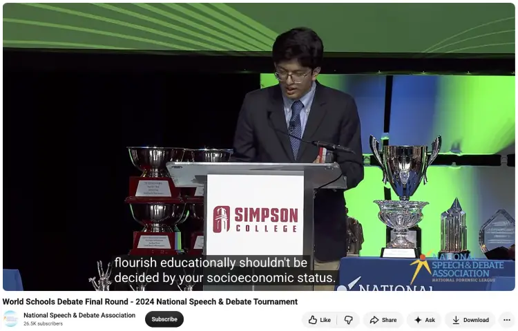 Student speaker delivering an argument during a formal debate at the National Speech and Debate Tournament.