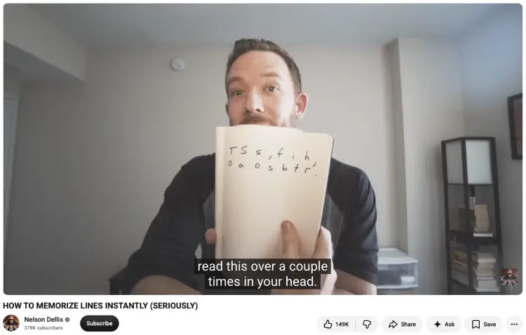 Memory expert Nelson Dellis holding a notebook with handwritten letter cues while demonstrating how to memorize a speech fast.